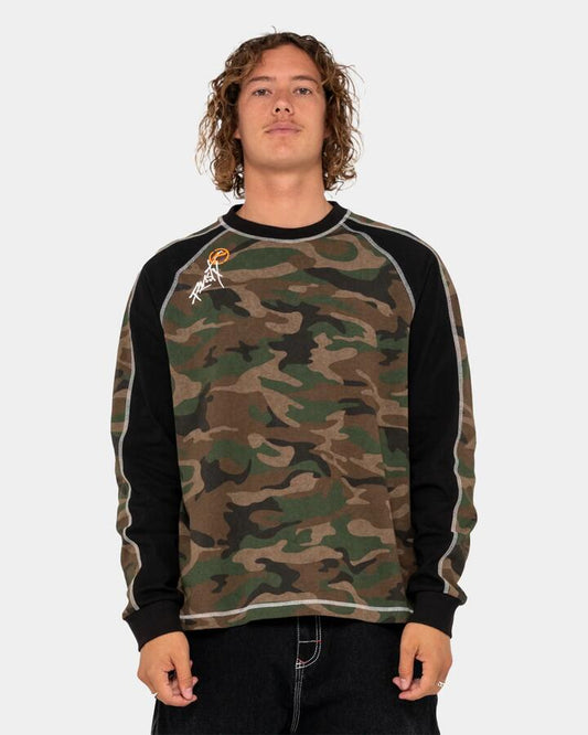 Image of a model wearing Tops. Product name - Rusty Mens Woof Raglang Long Sleeve T-Shirt Camo in Camo colour by brand - Rusty