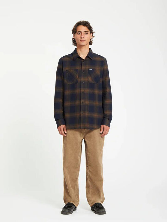 Image of a model wearing Tops. Productname: Volcom - Mens Netastone Flannel Long Sleeve Shirt - Dark Earth - in Dark Earth colour by brand - Volcom