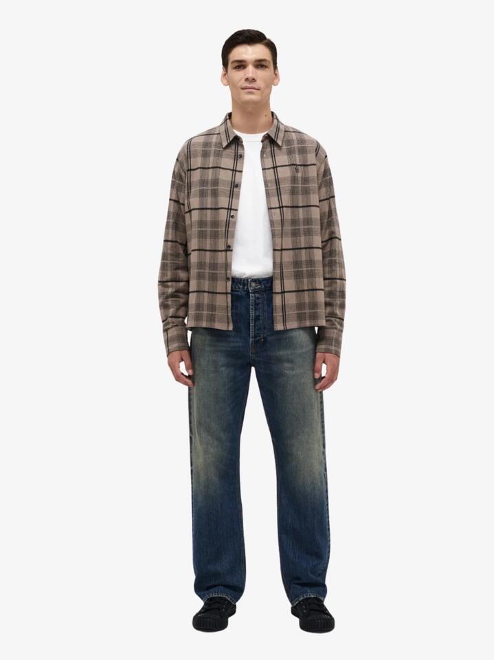 Image of a model wearing Denim. Productname: Neuw River Baggy Delphi in MID INDIGO colour by brand - Neuw