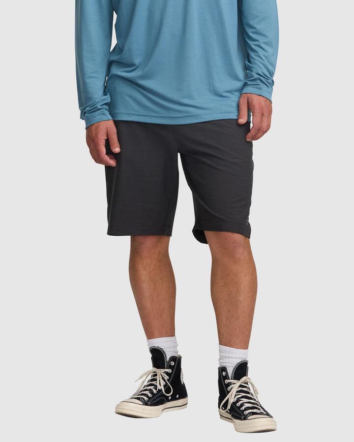 Image of a model wearing Shorts. Product name - Billabong Mens Crossfire 21" Hybrid Shorts Black - in Black colour by brand - Billabong