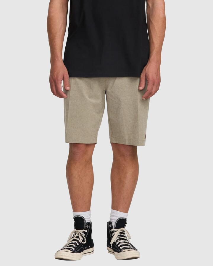 Image of a model wearing Shorts. Product name - Billabong Mens Crossfire 21" Hybrid Shorts Khaki in Khaki colour by brand - Billabong