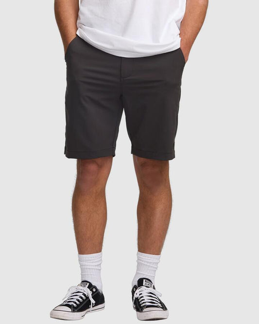 Image of a model wearing Shorts. Productname: Billabong - Mens Surftek 20" Hybrid Shorts - Black - in Black colour by brand - Billabong