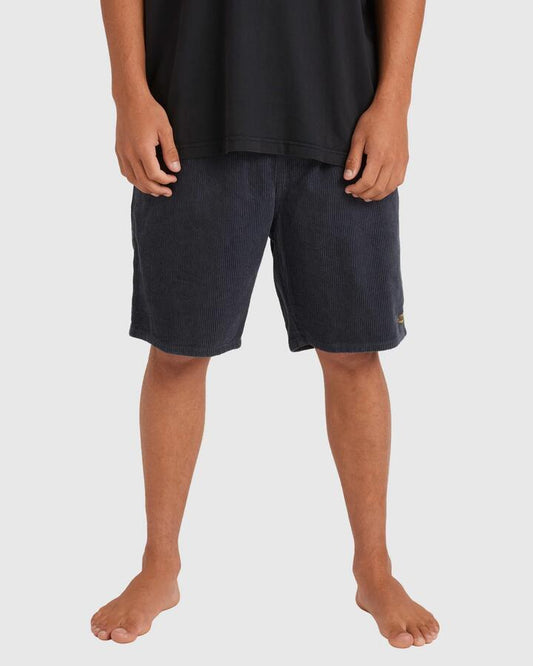 Image of a model wearing Shorts. Product name - Billabong Mens Larry Cord Walkshorts Midnight Blue in Midnight Blue colour by brand - Billabong