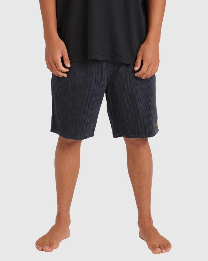 Image of a model wearing Shorts. Product name - Billabong Mens Larry Cord Walkshorts Midnight Blue in Midnight Blue colour by brand - Billabong