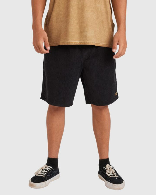 Image of a model wearing Shorts. Product name - Billabong Mens Larry Cord Walkshorts Char in Char colour by brand - Billabong