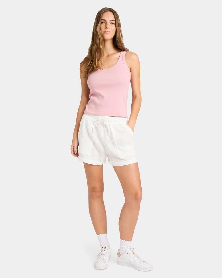 Image of a model wearing Tops. Productname: Nunui - Womens Scoop Action Tank - Dusty Pink - in Dusty Pink colour by brand - Nunui