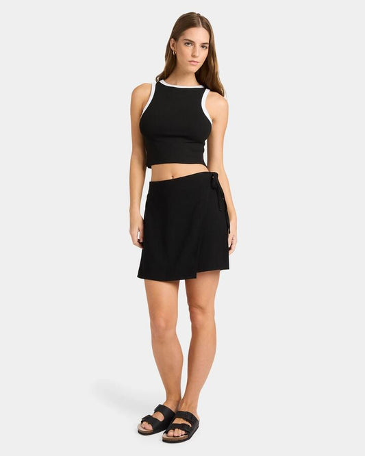 Image of a model wearing Skirts. Product name - Nunui Womens Tied Up Skirt Black in Black colour by brand - Nunui