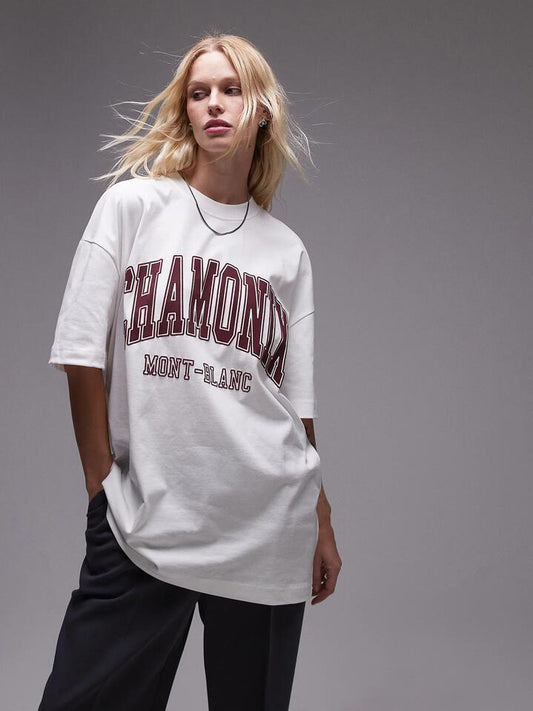 Image of a model wearing Tops. Productname: Topshop Premium Oversized Chamonix Tee in White colour by brand - Topshop