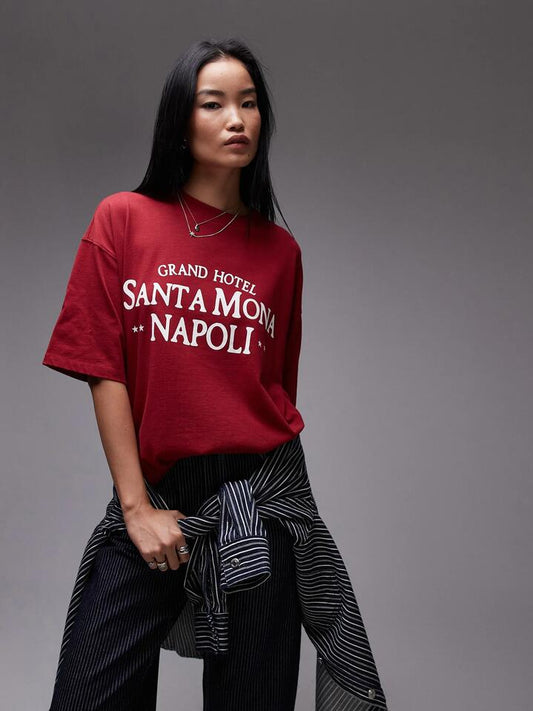 Image of a model wearing Tops. Productname: Topshop Santa Mona Napoli Oversized Tee in Red colour by brand - Topshop