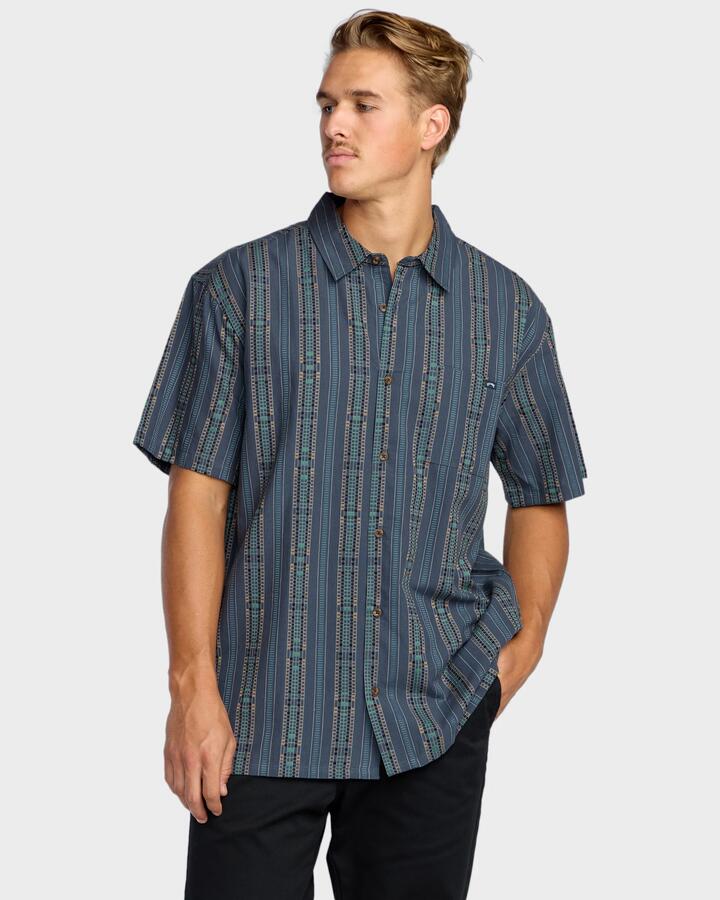Image of a model wearing Tops. Productname: Billabong - Mens Sundays Jaquard Short Sleeve Shirt - Dark Navy - in Dark Navy colour by brand - Billabong