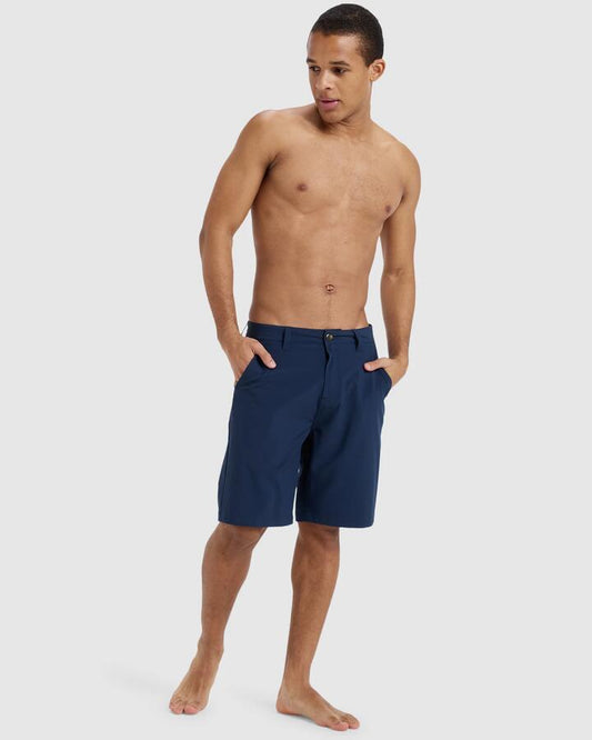 Image of a model wearing Shorts. Productname: Quiksilver - Mens Union Amphibian 20" Hybrid Shorts - Dark Navy - in Dark Navy colour by brand - Quiksilver