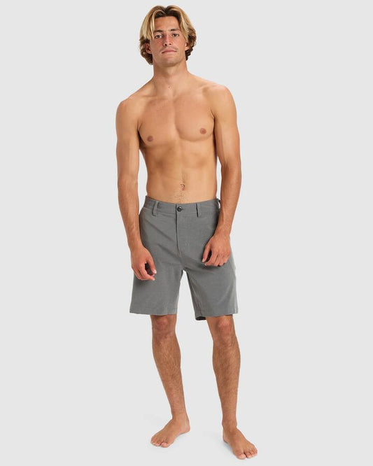 Image of a model wearing Shorts. Productname: Quiksilver - Mens Union Heater Amphibian 19" Hybrid Shorts - Black Heather - in Black Heather colour by brand - Quiksilver