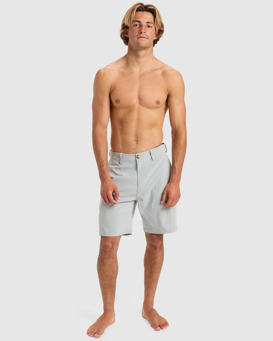 Image of a model wearing Shorts. Productname: Quiksilver - Mens Union Heater Amphibian 19" Hybrid Shorts - Quarry Heather - in Quarry Heather colour by brand - Quiksilver
