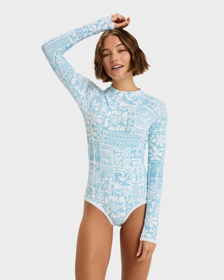 Image of a model wearing Tops. Product name - Roxy Womens Flowers Wave Long Sleeve Onesie Rash Vest Sky Blue Surfenirs in Sky Blue Surfenirs colour by brand - Roxy