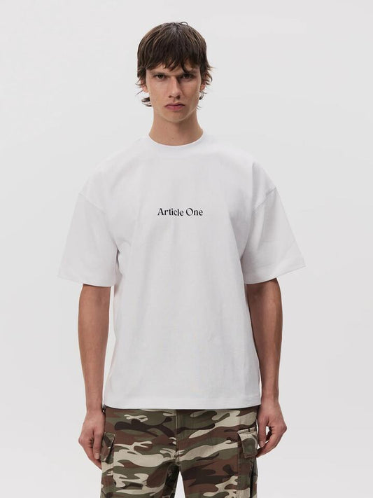 Image of a model wearing Tops. Productname: Article One Mariposa Logo Tee in White colour by brand - Article One
