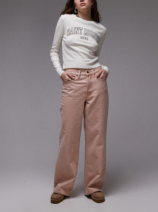 Image of a model wearing Denim. Productname: Topshop Mid Rise Straight Jeans in Blush Pink colour by brand - Topshop
