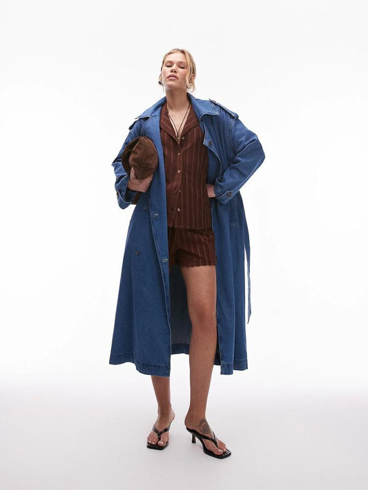 Image of a model wearing Denim. Productname: Topshop Denim Trench Coat in Mid Blue colour by brand - Topshop