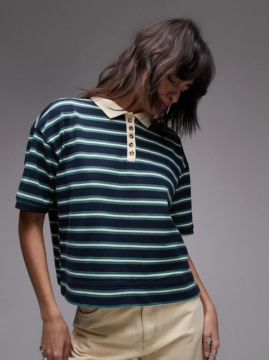 Image of a model wearing Shorts. Productname: Topshop Stripe Boxy Short Sleeve Polo in Navy colour by brand - Topshop