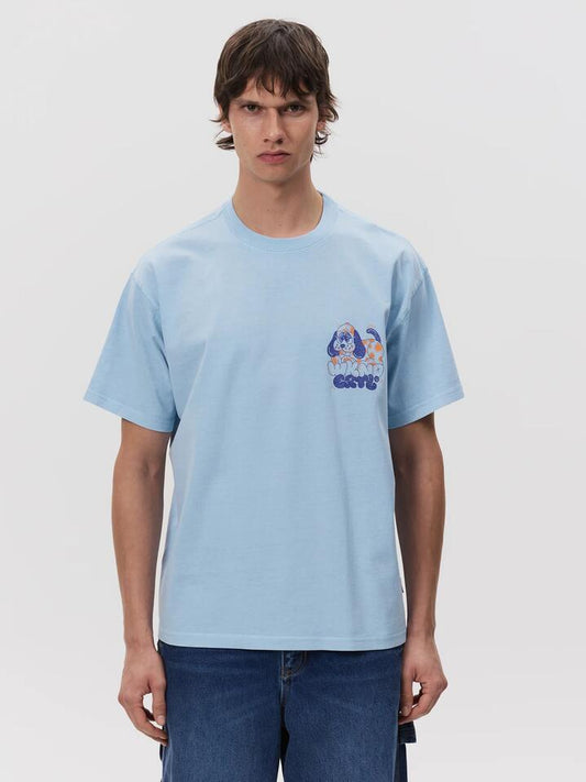 Image of a model wearing Tops. Productname: Weekend Cartel Puppy Tee in Sky colour by brand - Weekend Cartel
