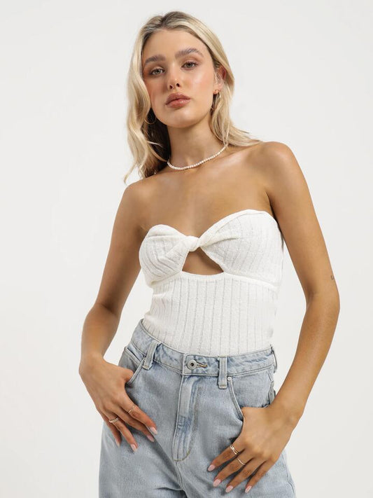 Image of a model wearing Tops. Productname: Lulu & Rose Huxley Knit Top in White colour by brand - Lulu & Rose