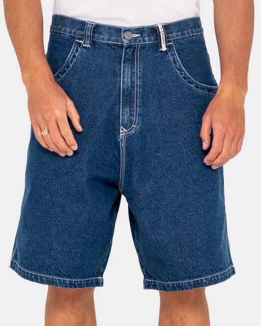 Image of a model wearing Shorts. Productname: Rusty - Mens Flip Daddy Tapeless Denim Shorts - Deep Sea Blue - in Deep Sea Blue colour by brand - Rusty