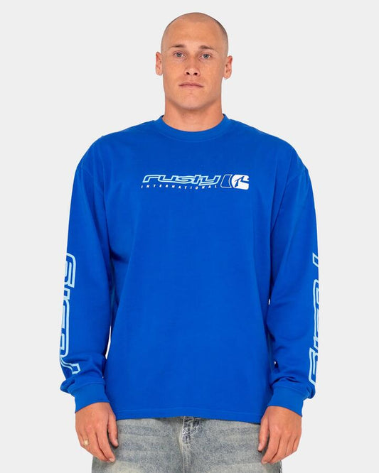 Image of a model wearing Tops. Productname: Rusty Mens Jetsetter Long Sleeve T-Shirt Royal Blue - in Royal Blue colour by brand - Rusty
