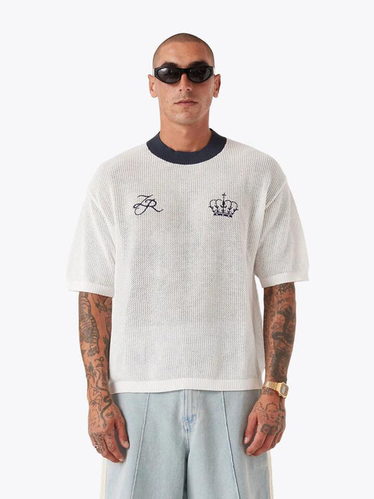 Image of a model wearing Tops. Productname: Zanerobe Knitted Baseball Jersey in VINTAGE WHITE/CHERRY colour by brand - Zanerobe