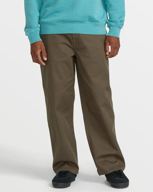 Image of a model wearing Pants. Productname: Volcom - Mens Billow Twill Chino - Wren - in Wren colour by brand - Volcom