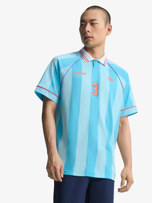 Image of a model wearing Tops. Productname: Adidas Jacquard Jersey in BRIGHT CYAN colour by brand - Adidas