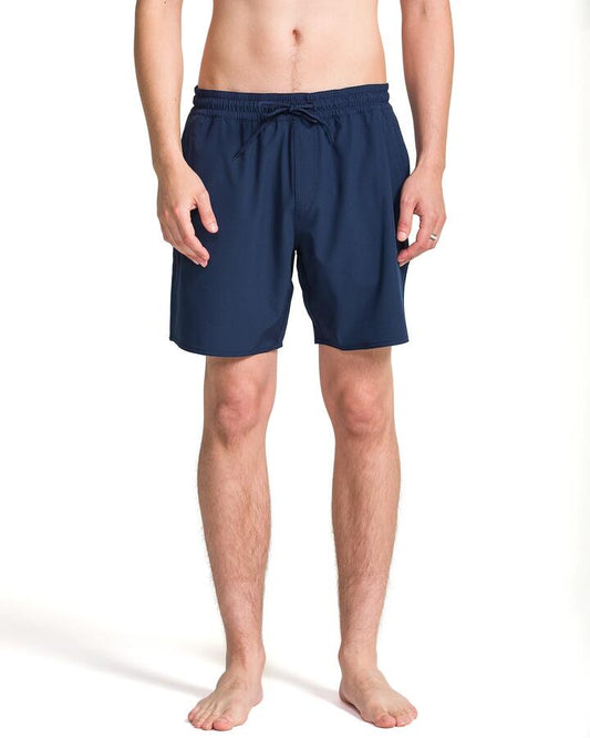 Image of a model wearing Shorts. Productname: Volcom Mens Manic Solid Trunk 17" Swim Shorts Navy Paint - in Navy Paint colour by brand - Volcom