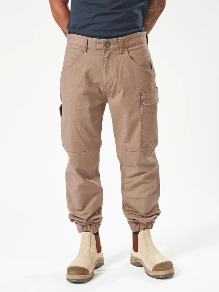Image of a model wearing Pants. Productname: Volcom Mens Caliper Ii Cuff Carpenter Pants Brindle - in Brindle colour by brand - Volcom