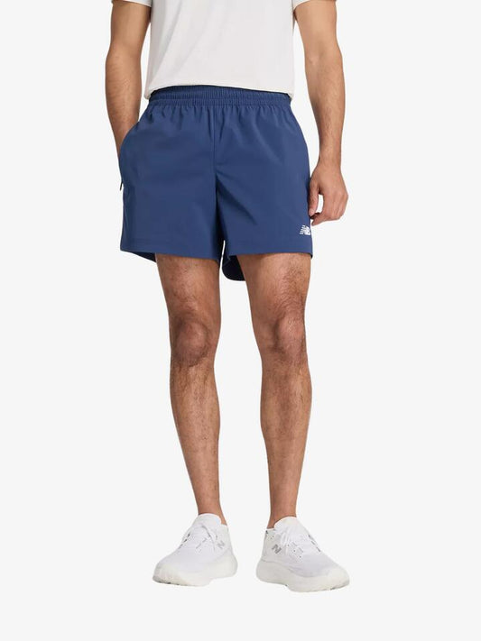 Image of a model wearing Shorts. Productname: New Balance Athletics Stretch Woven 5 in Nb Navy colour by brand - New Balance