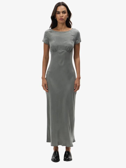 Image of a model wearing Dress. Productname: Lulu & Rose Chere Cupro Maxi Dress in Silver colour by brand - Lulu & Rose