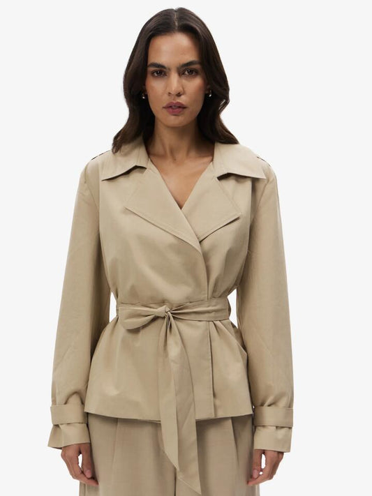 Image of a model wearing Outerwear. Productname: Lulu & Rose Lori Short Trench in Fawn colour by brand - Lulu & Rose