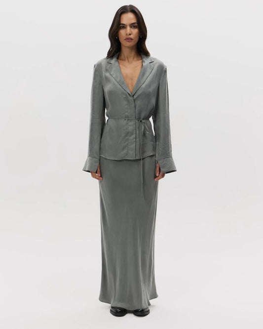 Image of a model wearing Skirts. Productname: Lulu & Rose Chere Cupro Midi Skirt in Silver colour by brand - Lulu & Rose