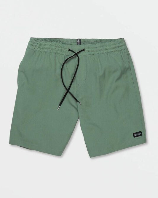 Image of a model wearing Shorts. Productname: Volcom Mens Stones 18" Hybrid Shorts Dark Forest - in Dark Forest colour by brand - Volcom
