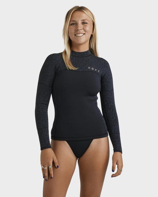 Image of a model wearing Tops. Product name - Roxy Womens 1Mm Swell Long Sleeve Wetsuit Top Animal Print in Animal Print colour by brand - Roxy