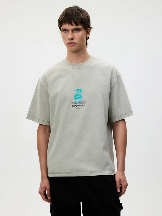 Image of a model wearing Tops. Productname: Thrills Pure Delusion Box Fit Oversize Tee in Sea Pine colour by brand - Thrills