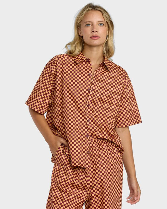 Image of a model wearing Tops. Productname: RVCA - Womens Devon Short Sleeve Shirt - Ochre - in Ochre colour by brand - RVCA