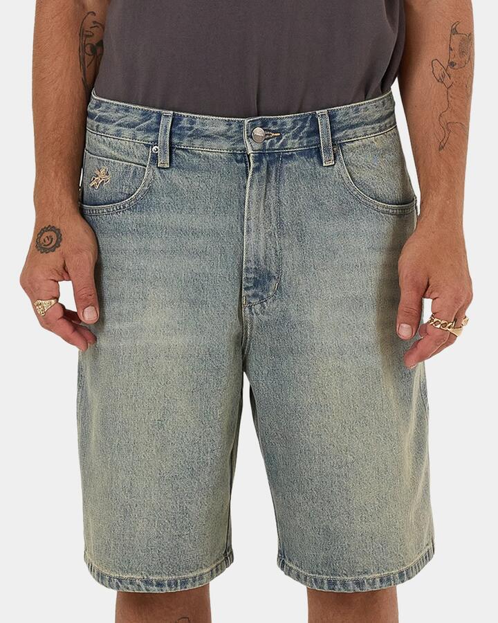 Image of a model wearing Shorts. Productname: Worship - Mens Throws Big Dawg Denim Shorts - Blue - in Blue colour by brand - Worship