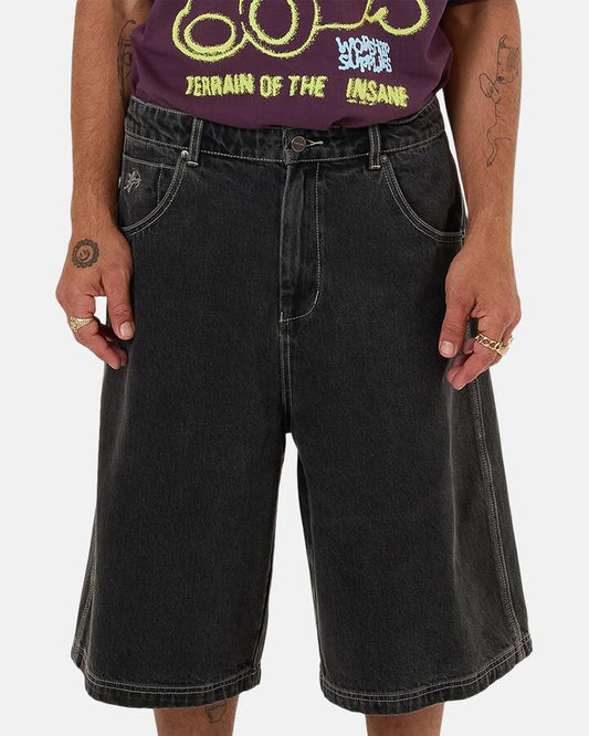 Image of a model wearing Shorts. Productname: Worship - Mens Terrain Dozer Denim Shorts - Black - in Black colour by brand - Worship