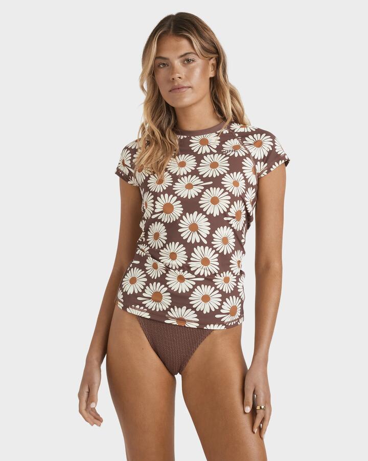 Image of a model wearing Tops. Productname: Billabong Womens Wahine Short Sleeve Rash Vest Espresso - in Espresso colour by brand - Billabong