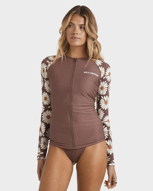 Image of a model wearing Tops. Product name - Billabong Womens Pipa Upf 50 Long Sleeve Rash Vest Espresso in Espresso colour by brand - Billabong