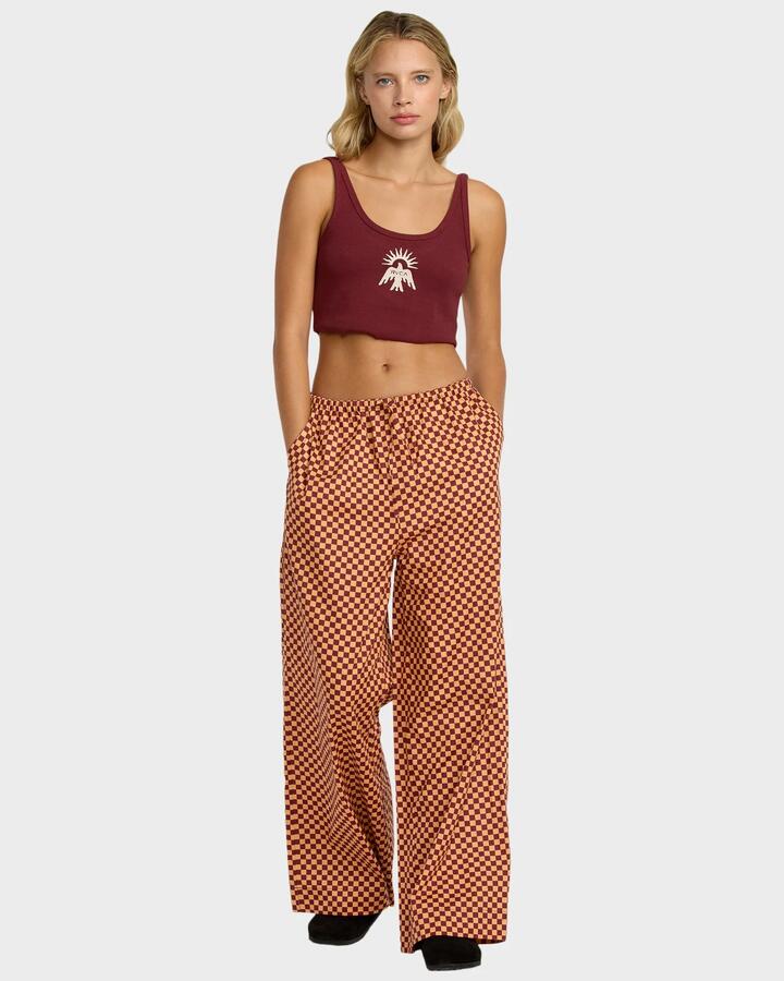 Image of a model wearing Pants. Productname: RVCA - Womens Holiday Pants - Ochre - in Ochre colour by brand - RVCA