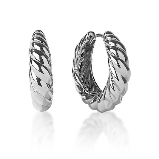 Image of Earrings. Productname: Large Croissant Huggie Earrings in Sterling Silver in Silver colour by brand - Bevilles