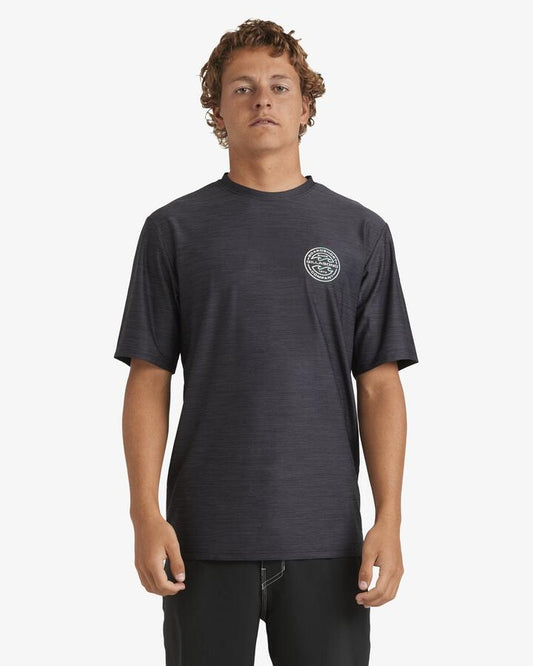 Image of a model wearing Tops. Productname: Billabong - Mens Rotor Shoreline Short Sleeve Rash Vest - Black Heather - in Black Heather colour by brand - Billabong