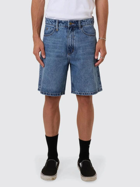 Image of a model wearing Denim. Productname: Thrills Slacker Denim Short in Stoned Blues colour by brand - Thrills
