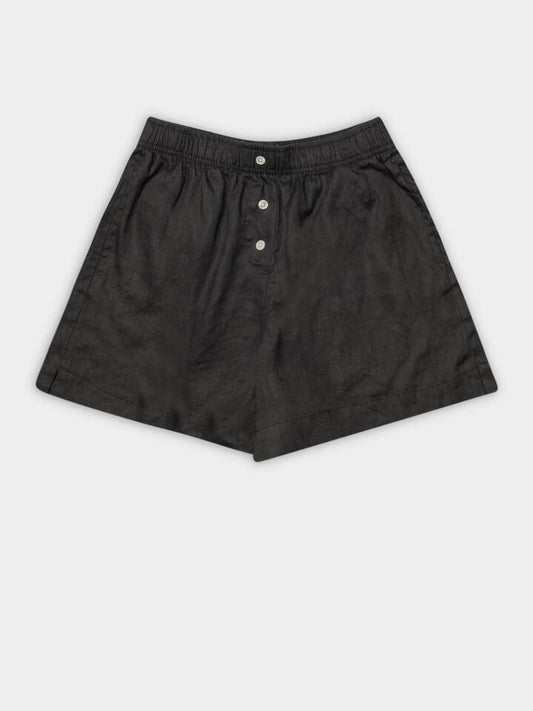 Image of a model wearing Shorts. Productname: Nude Lucy Nude Linen Lounge Short in Coal colour by brand - Nude Lucy