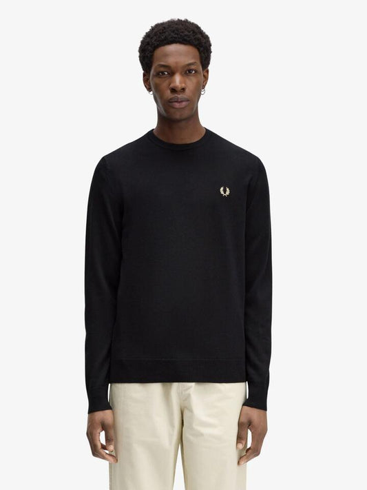 Image of a model wearing Outerwear. Productname: Fred Perry Classic Crew Neck Jumper in Black colour by brand - Fred Perry