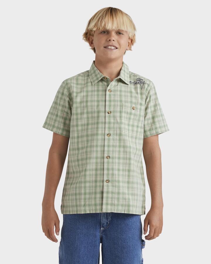 Image of a model wearing Tops. Productname: Billabong Boys 8-16 Mogul Checkerd Short Sleeve Shirt Oatmeal - in Oatmeal colour by brand - Billabong